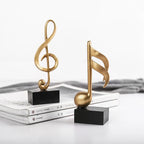 Estatuetas Decorativas de Notas Musicais em Resina Dourada