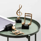 Estatuetas Decorativas de Notas Musicais em Resina Dourada